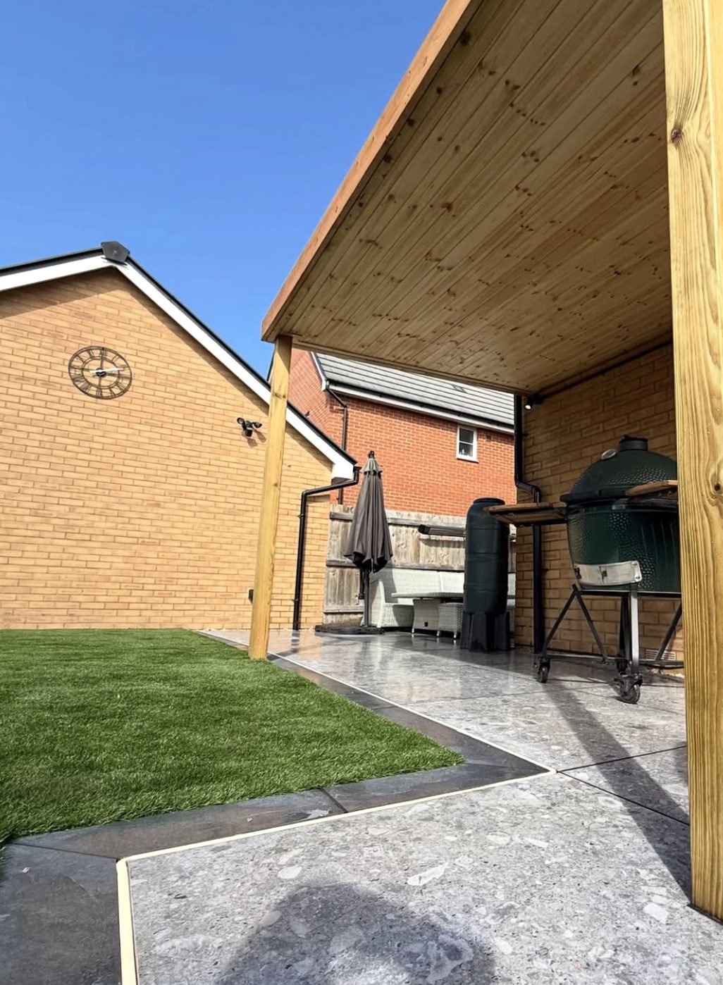Premium artificial lawn and astroturf with porcelain patio and timber pergola