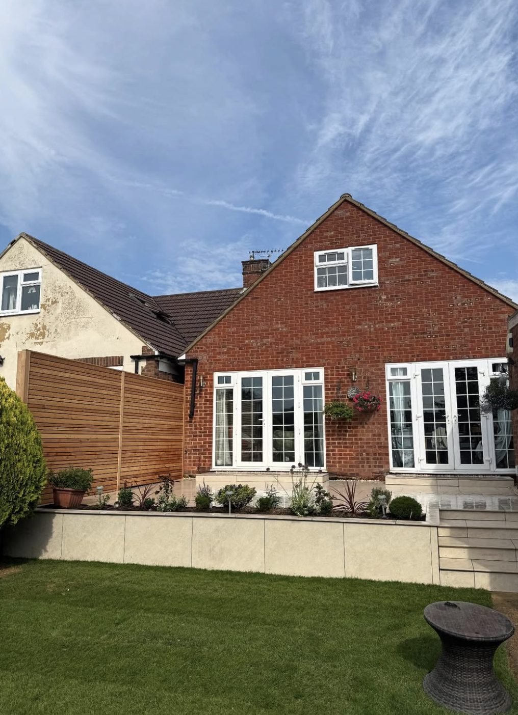 Contemporary slatted screening and porcelain raised beds